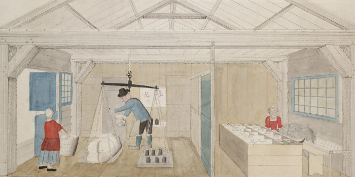 De lompenschuur van een papiermakerij. Links worden de lompen gewogen. Rechts worden de lompen gesorteerd.