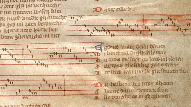 Foto van een uitsnede van het Gruuthusehandschrift met muzieknotatie en tekst